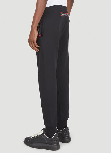 LN-CC® - Alexander McQueen: Logo Tape Track Pants - Black Alexander McQueen Logo Tape Track Pants Black amq0147017